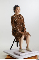    Aera  1 brown dots dress casual dressed sitting white oxford shoes whole body 0006.jpg